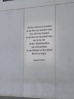 A wall inscription ending with the words But let us begin