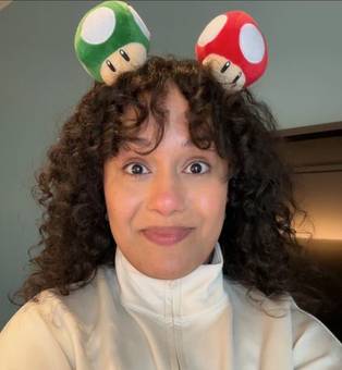 Jessenia wearing toy mushrooms on her head
