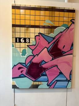 A graffiti-style painting of a subway wall marked 168