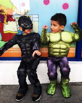 Two boys in superhero costumes